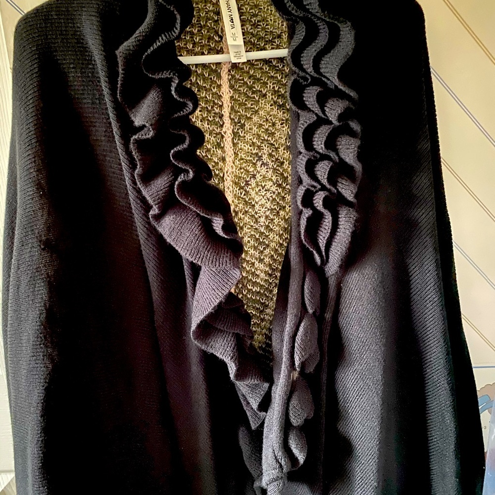 Black ruffled cape